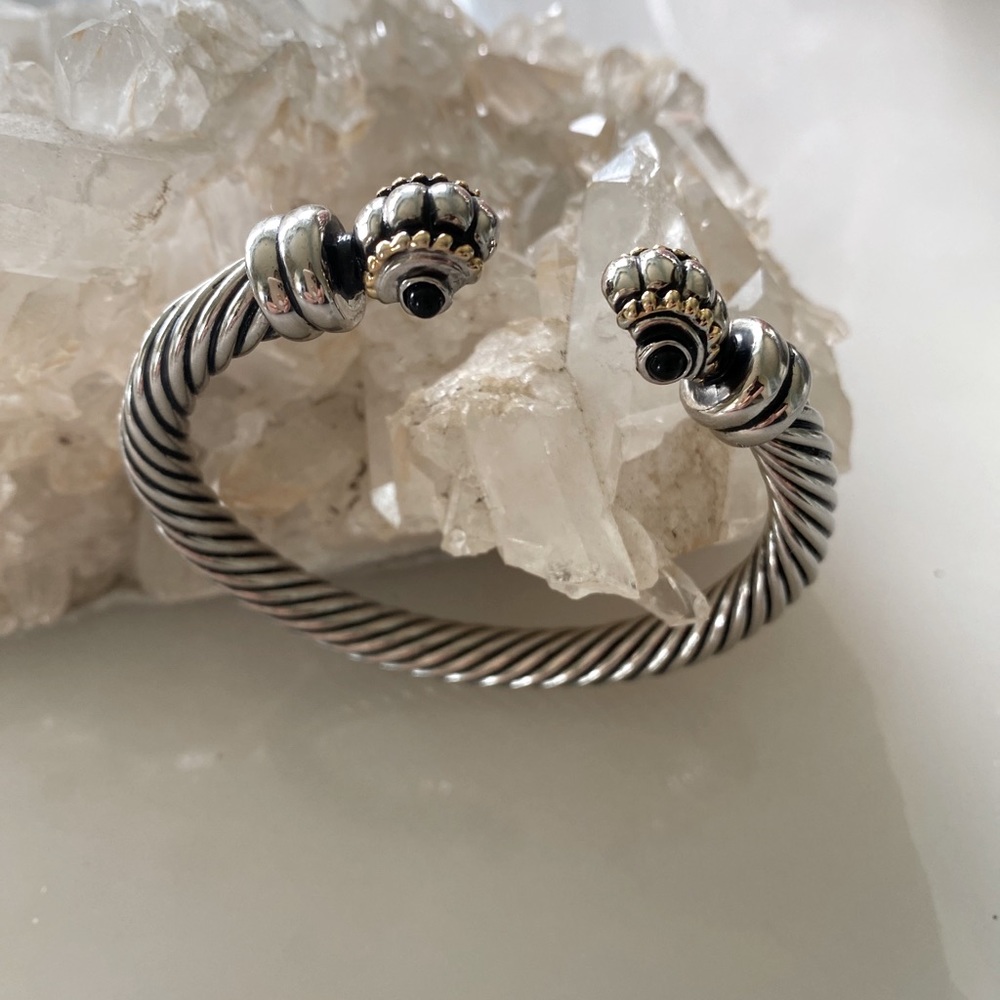 Two tone weighty bracelet with onyx like stones.